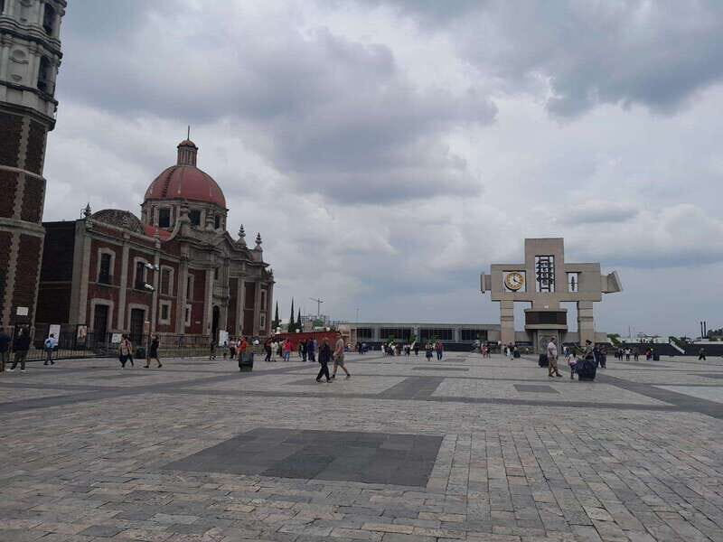 Basilica de Guadalupe: Complete Walking Tour - Meeting at La Guadalupana: the purple guide with an axolotl