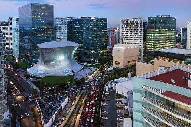 Private Contrasts of Mexico City Neighborhoods Tour - A Major Avenue Ride: Independence Monument and Torre Reforma Views