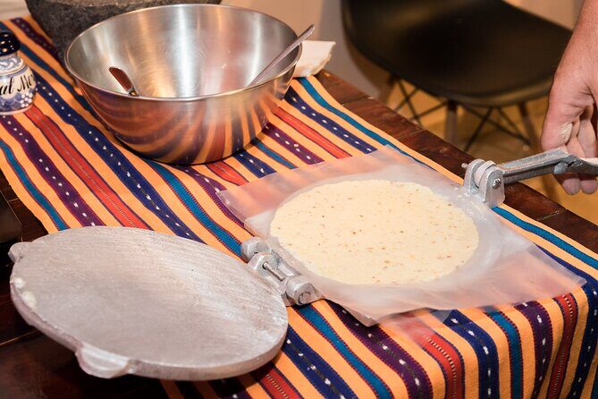 Tortilla Class and Workshop in Mexico - Clara’s metate moment: heirloom grinding up close