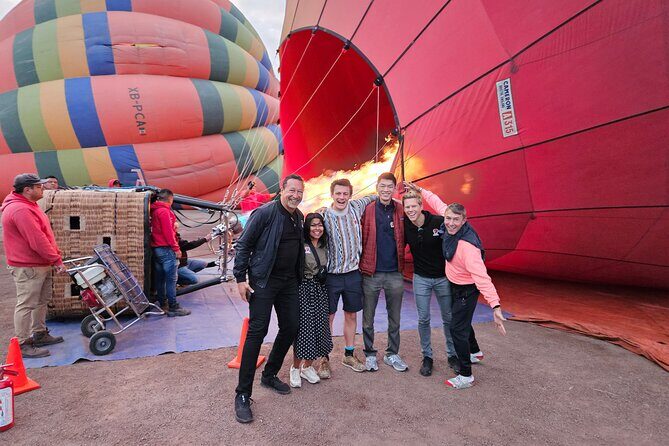 Unforgettable Hot Air Balloon Ride Over the City of the Gods - The launch area morning: coffee, waivers, and watching the balloons rise