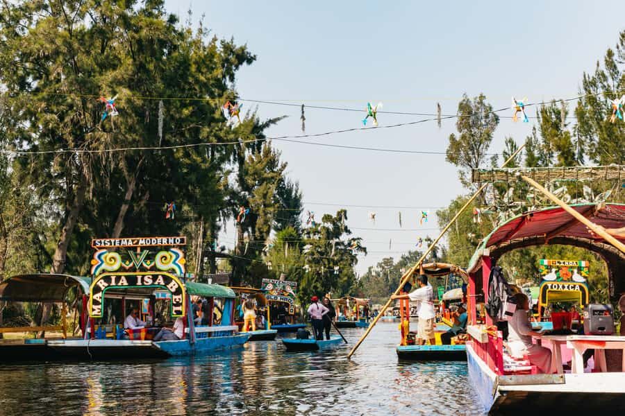 Xochimilco: traditional boat tour, culture, and fun. - Stepping onto the trajinera: souvenirs, sweets, and the drink setup